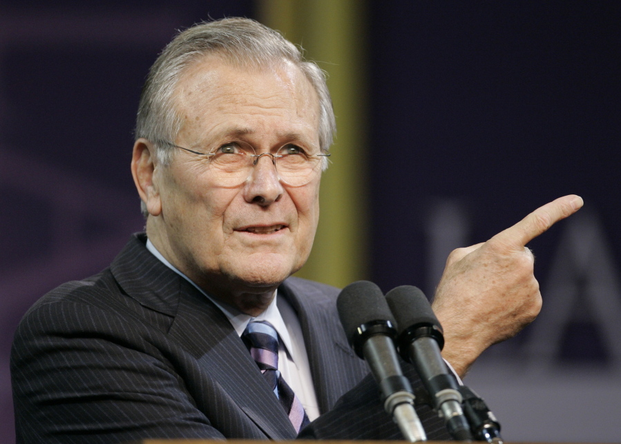 FILE - In this Nov. 9, 2006, file photo, Defense Secretary Donald Rumsfeld asks for another question following his Landon Lecture at Kansas State University in Manhattan, Kan.  News of the death of former U.S. Defense Secretary Donald Rumsfeld has hit far differently in Baghdad than in the U.S. capital. Rumsfeld, whose service under four U.S. presidents was stained by the ruinous U.S.-led invasion of Iraq, died on Wednesday, June 30, 2021.