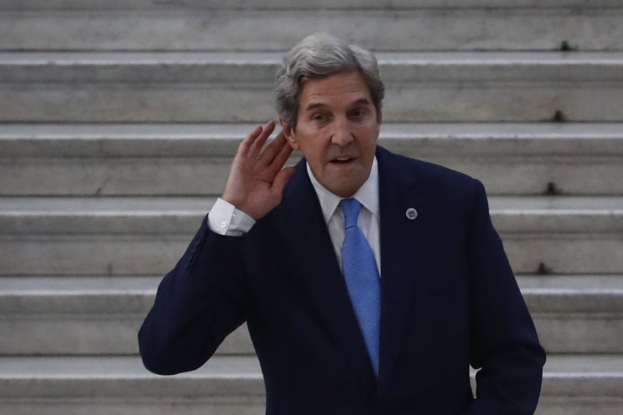 Special Presidential Envoy for Climate John Kerry gestures during a photo opportunity with Italian Minister for Ecological Transition Roberto Cingolani, at Palazzo Reale in Naples, Italy, on Friday.