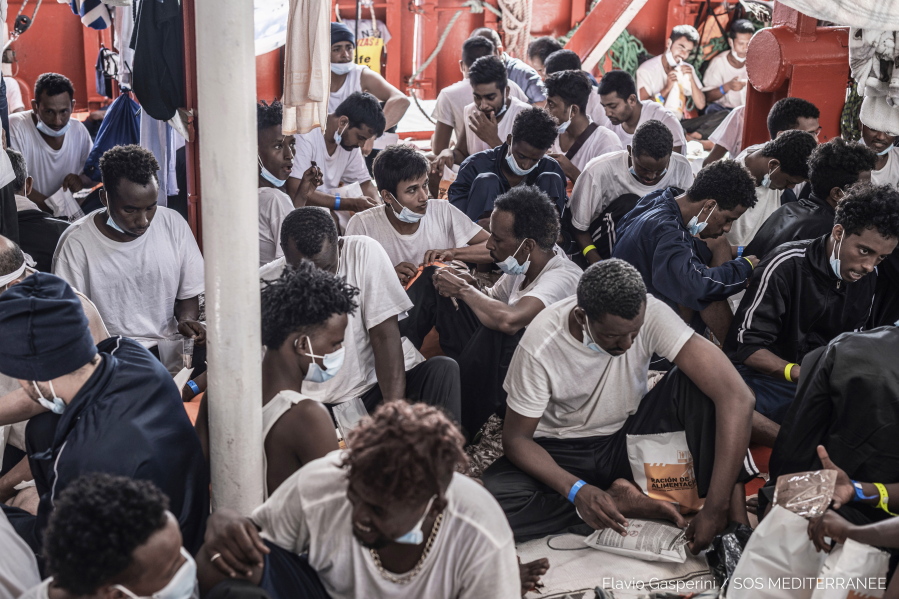 Food is being distributed to migrants aboard the Ocean Viking rescue, in the Mediterranean Sea on Thursday, July 8, 2021. A charity rescue ship with 572 migrants aboard is pleading for permission to dock in the Mediterranean as food runs short. Luisa Albera, an official of the humanitarian group SOS MEDITERRANEE, launched an urgent appeal on Thursday for the passengers on the Ocean Viking.