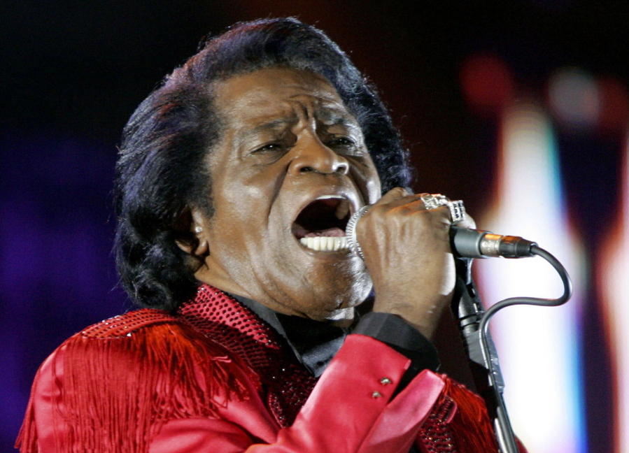 FILE - In this July 6, 2005 file photo, James Brown performs on stage during the Live 8 concert at Murrayfield Stadium in Edinburgh, Scotland. The family of entertainer James Brown has reached a settlement ending a 15-year battle over late singer's estate. David Black, an attorney representing Brown's estate, confirmed to The Associated Press on Friday, July 23, 2021 that the agreement was reached July 9.