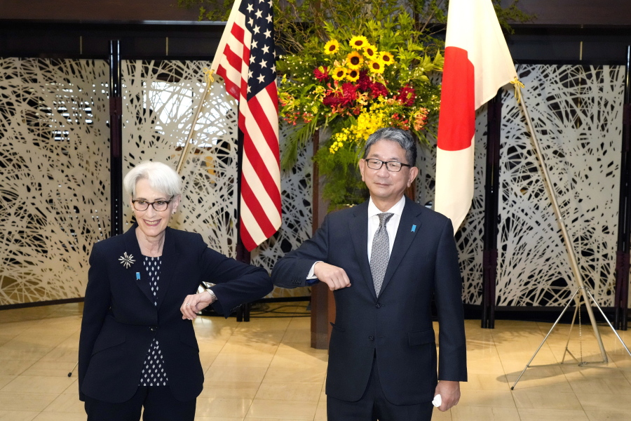 U.S. Deputy Secretary of State Wendy Sherman, left, elbow bumps with Japanese Vice-Minister for Foreign Affairs Takeo Mori, right, prior to their meeting at the Iikura Guesthouse Tuesday, July 20, 2021, in Tokyo.
