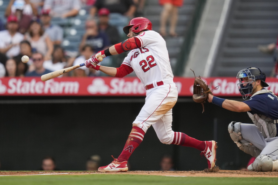 Los Angeles Angels' David Fletcher (22) doubles during the second inning of a baseball game against the Seattle Mariners Saturday, July 17, 2021, in Anaheim, Calif. Taylor Ward, Juan Lagares, and Jack Mayfield scored.