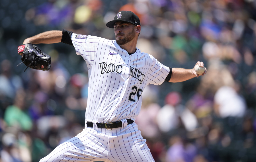 Colorado Rockies starting pitcher Austin Gomber works against the Seattle Mariners in the first inning of a baseball game Wednesday, July 21, 2021, in Denver.