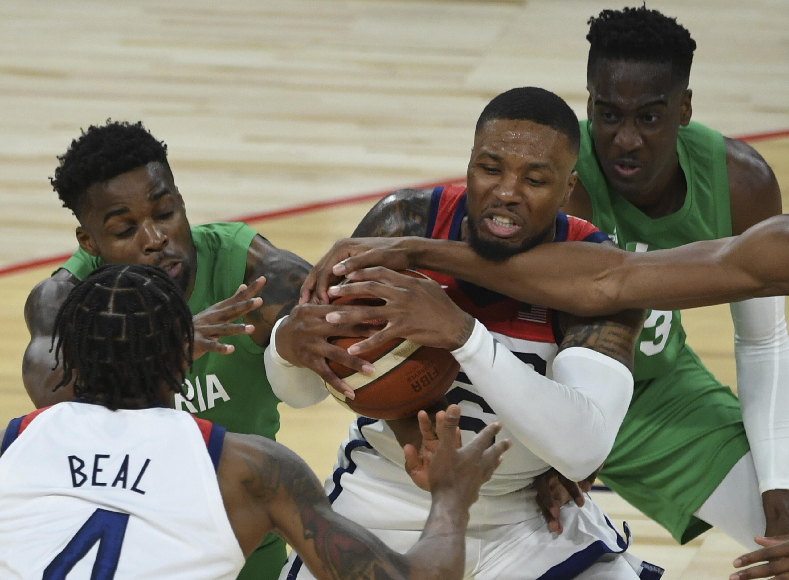 United States' Damian Lillard (6) defends the ball against Nigeria during an exhibition basketball game Saturday, July 10, 2021, in Las Vegas.