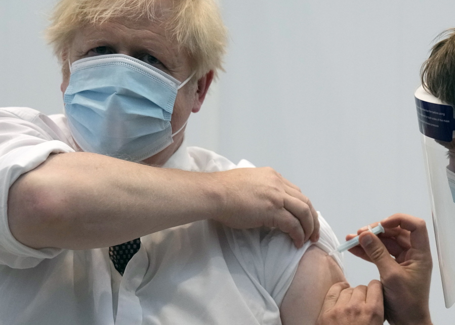 FILE - In this Thursday, June 3, 2021 file photo, British Prime Minister Boris Johnson gives a thumbs up after receiving his second jab of the AstraZeneca coronavirus vaccine, at the Francis Crick Institute in London. On Friday, July 2 The Associated Press reported on stories circulating online incorrectly asserting that data from the U.K.'s public health agency confirms that those who have been vaccinated against COVID-19 are anywhere from two times to six times more likely to die from the delta variant than the unvaccinated. But, the data, which was published June 18, shows the Pfizer and AstraZeneca vaccines are highly effective against hospitalization from the variant.