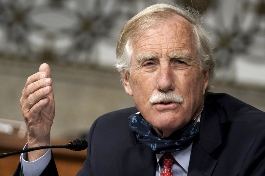 FILE - In this May 6, 2020 file photo, Sen. Angus King, I-Maine, asks questions during the Senate Armed Services Committee hearing on the Department of Defense Spectrum Policy and the Impact of the Federal Communications Commission's Ligado Decision on National Security during the COVID-19 coronavirus pandemic on Capitol Hill in Washington. A Senate bill that seeks to speed up philanthropic donations to charities appears to be gaining bipartisan support in Congress, taking aim at a popular charitable vehicle called donor-advised funds. DAFs allow donors to enjoy immediate tax deductions while investing their contributions tax-free. The bill, introduced by Sens. King and Chuck Grassley, an Iowa Republican, would make numerous reforms to DAFs by creating new categories of accounts, among other changes.