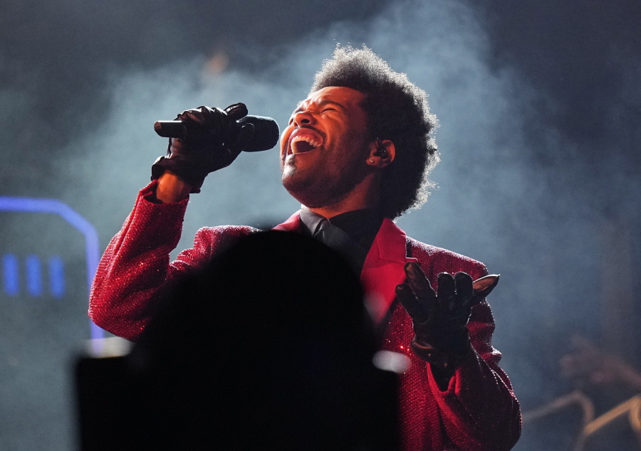 FILE - The Weeknd performs during the halftime show of the NFL Super Bowl 55 football game on Feb. 7, 2021, in Tampa, Fla. The Weeknd, BTS and Billie Eilish will participate in Global Citizen Live, a 24-hour event on Sept. 21 organized to raise funding and awareness to battle worldwide issues including COVID-19, climate change and extreme poverty. (AP Photo/David J.