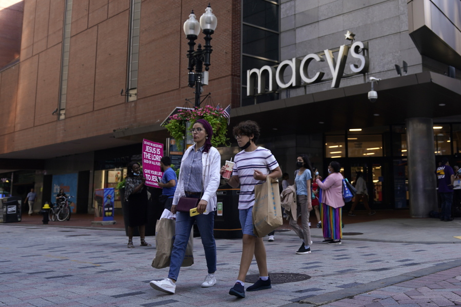 Pedestrians pass the Macy's store in the Downtown Crossing shopping area, Wednesday, July 14, 2021, in Boston.  . U.S. retail sales rose a seasonal adjusted 0.6% in June from the month before, the U.S. Commerce Department said Friday, July 16.