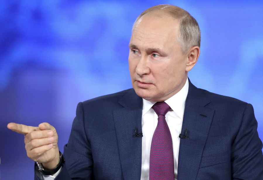 Russian President Vladimir Putin attends his annual live call-in show in Moscow, Russia, Wednesday, June 30, 2021. Speaking in a live call-in program Wednesday, Vladimir Putin has voiced hope that the country could avoid a nationwide lockdown amid a surge of new infections.