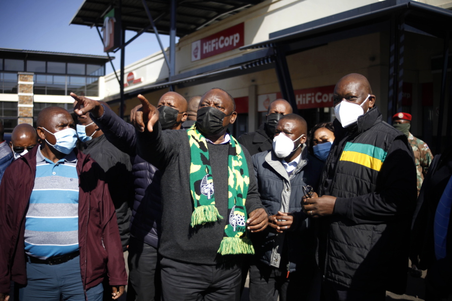 South African President Cyril Ramaphosa, on a visit to Soweto, South Africa, Sunday July 18 2021. Ramaphosa went to Johannesburg's Soweto township to view badly damaged retail centers where people were trampled to death in rioting sparked by the imprisonment of former President Jacob Zuma.