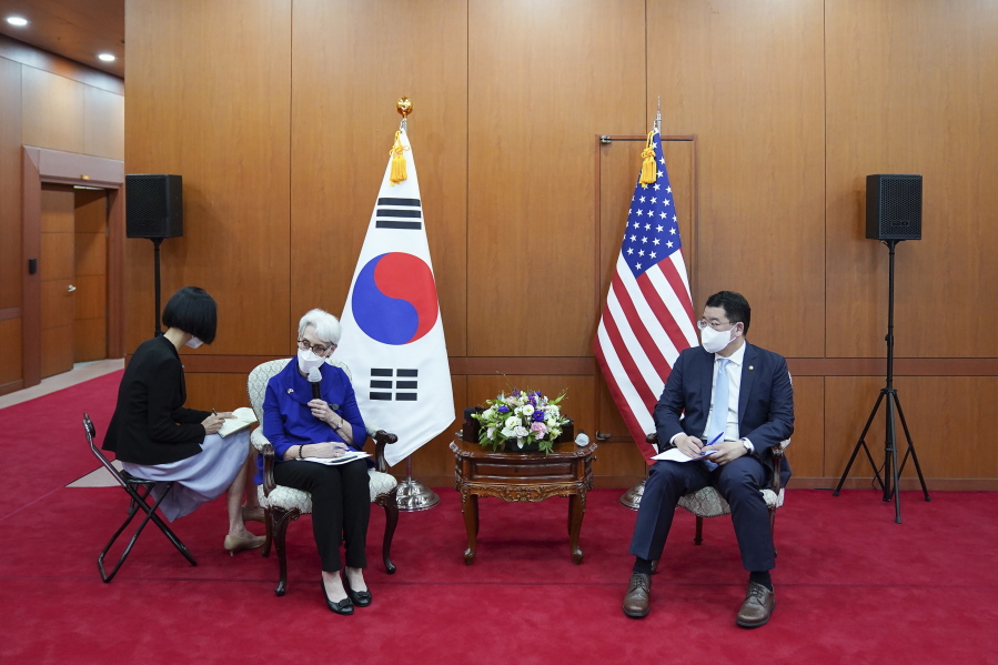 In this photo provided by South Korea Foreign Ministry, U.S. Deputy Secretary of State Wendy Sherman, second from left, talks to journalists as South Korean First Vice Foreign Minister Choi Jong Kun listens after their meeting at the Foreign Ministry in Seoul, South Korea, Friday, July 23, 2021. America's No. 2 diplomat on Friday expressed sympathy for North Koreans facing hardships and food shortages linked to the pandemic, and renewed calls for the North to return to talks over its nuclear program.