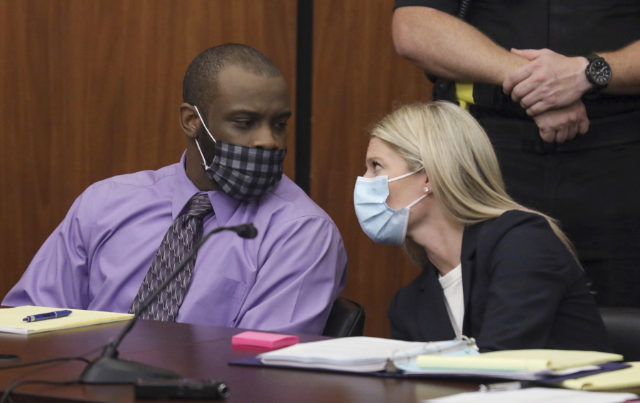 Defendant Nathaniel Rowland speaks with his attorney, Alicia Goode, right, during his trial in Richland County Court, Tuesday, July 20, 2021, in Columbia, S.C. Rowland is on trial for the kidnapping and murder of 21-year-old Samantha Josephson.