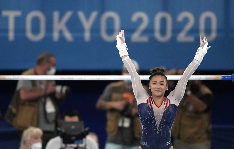 Sunisa Lee, of the United States, finishes on the uneven bars during the artistic gymnastics women's all-around final at the 2020 Summer Olympics, Thursday, July 29, 2021, in Tokyo.
