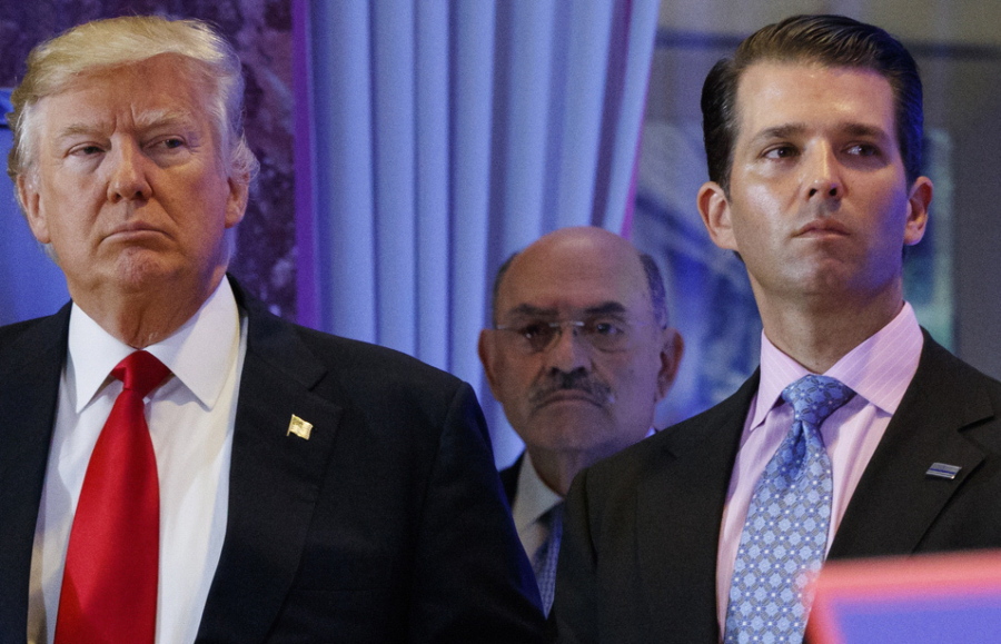 FILE - This file photo from Wednesday Jan. 11, 2017, shows President-elect Donald Trump, left, his chief financial officer Allen Weisselberg, center, and his son Donald Trump Jr., right, during a news conference at Trump Tower in New York. Prosecutors in New York are expected to bring the first criminal charges in a two-year investigation into Trump's business practices, accusing his namesake company and its longtime finance chief Weisselberg of tax crimes.
