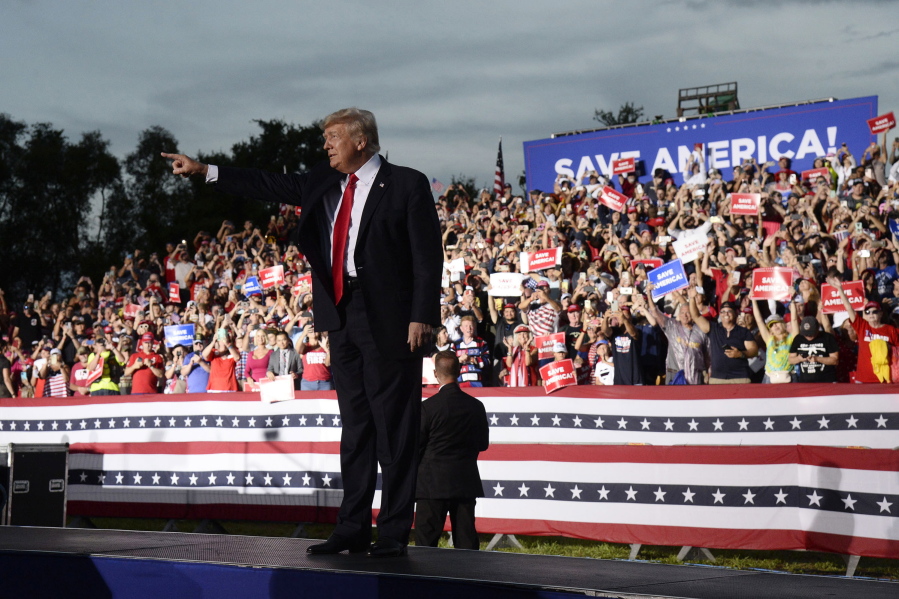 Former President Donald Trump walks on stage during a rally at the Sarasota Fairgrounds Saturday, July 3, 2021, in Sarasota, Fla.