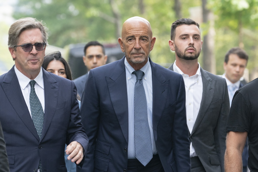 Tom Barrack, center, arrives at Brooklyn federal court, Monday, July 26, 2021, in New York. Barrack was among three men charged in New York federal court with trying to influence foreign policy while Donald Trump was running in 2016 and later while president. The chair of former President Donald Trump's 2017 inaugural committee allegedly conspired to influence U.S. policy to benefit the United Arab Emirates, even while he was seeking a position as an American diplomat.