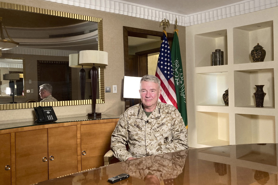 FILE - In this May 23, 2021, file photo Marine Gen. Frank McKenzie, top U.S. commander for the Middle East, speaks to reporters traveling with him in Riyadh, Saudi Arabia. Although all combat troops and 20 years of accumulated war materiel will soon be gone, the head of U.S Central Command, Gen. Frank McKenzie, will have authority until September to defend Afghan forces against the Taliban. He can do so by ordering strikes with U.S. warplanes based outside of Afghanistan, according to defense officials who discussed details of military planning Thursday on condition of anonymity.