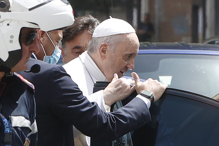 FILE - In this July 14, 2021 file photo, Pope Francis stops to greet police that escorted him as he arrives at the Vatican after leaving the hospital 10 days after undergoing planned surgery to remove half his colon. The Vatican on Wednesday, July 21, 2021, released a grueling travel itinerary for Pope Francis' first post-surgery foreign trip, scheduling around-the-clock encounters and hop-scotching, in-country flights for his Sept. 12-15 visit to Hungary and Slovakia.