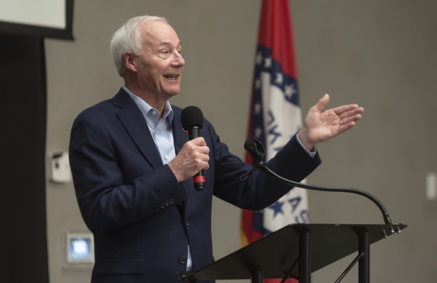 FILE - In this July 15, 2021, file photo, Arkansas Gov. Asa Hutchinson speaks during a town hall meeting in Texarkana, Ark.  Facing growing vaccine hesitancy, governors in states hard hit by the coronavirus pandemic are asking federal regulators to grant full approval to the shots in the hope that will persuade more people to get them. The governors of Arkansas and Ohio have appealed in recent days for full approval as virus cases and hospitalizations skyrocket in their states.
