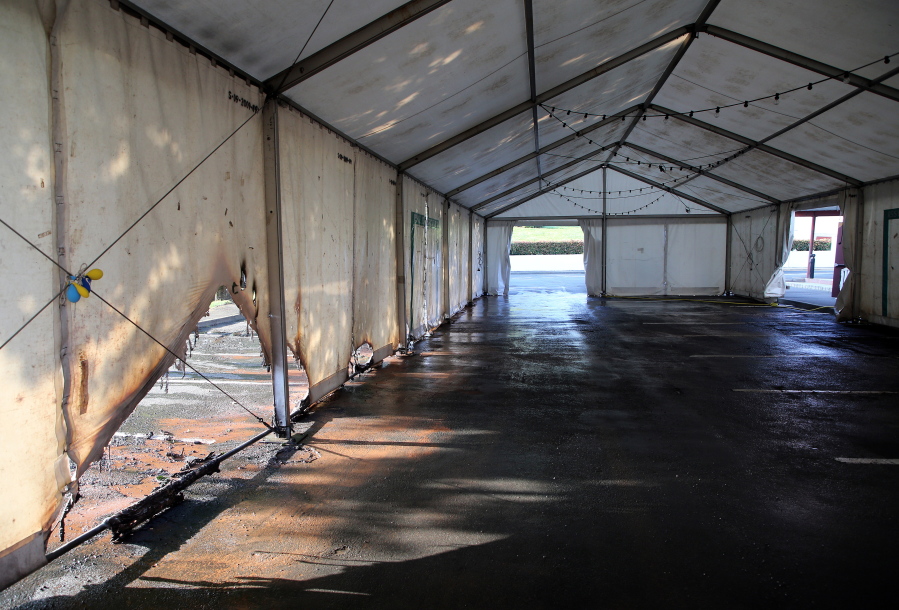 A view of the empty tent of a vaccination center after an arson attack on Saturday evening in Urrugne, southwestern France, Monday, July 19, 2021.Two Covid-19 vaccination centers were ransacked in less than 48 hours in France, over the weekend.
