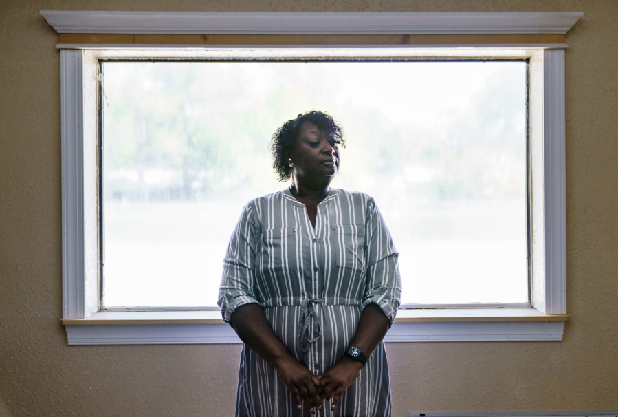 Latonya Crowley, mother of Warren Williams, stands for a portrait in Palatka, Fla., Thursday, April 22, 2021. An FBI probe revealed a murder plot against her son by klansmen working as prison guards where Williams was once an inmate. "In the state of mind that he's in today. I don't see him getting better," Crowley says, as she and her son live today with uncertainty and paranoia. One of the guards' imminent release and the specter of other klansmen have made it impossible for Williams to move on.