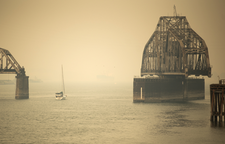 A sailboat makes its way past the railroad bridge in Vancouver through the smoke on Sept. 10, 2020. Smoke events in Vancouver tend to be weather-dependent, occurring when east winds bring smoke from elsewhere in the state to the western half.