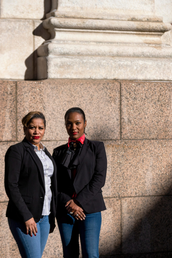 Tammy Turner, left, and Kerry Buffington, co-owners of Kapstone Employment Services, pose on January 27, 2021, in Detroit.