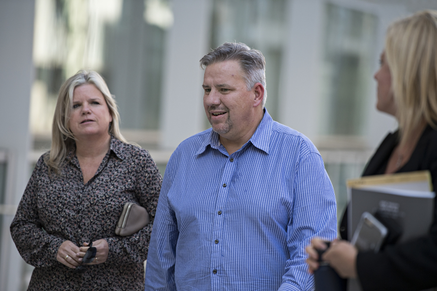 Michelle Bishop, from left, and her husband, former Vancouver pastor John Bishop, return to the courthouse for John Bishop's sentencing for unlawful importation of a controlled substance-marijuana after a recess at the James M. Carter and Judith N. Keep United States Courthouse in San Diego, Calif., on Sept. 21, 2018.
