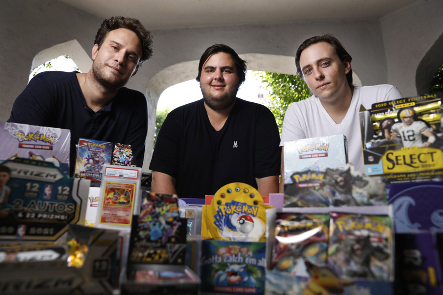 Anthony Jimenez, Michael Hotchkiss, and Gio Mancuso, from left, who run a live Instagram show selling and buying Pokemon collectibles, are photographed in Los Angeles on Friday, August 6, 2021.