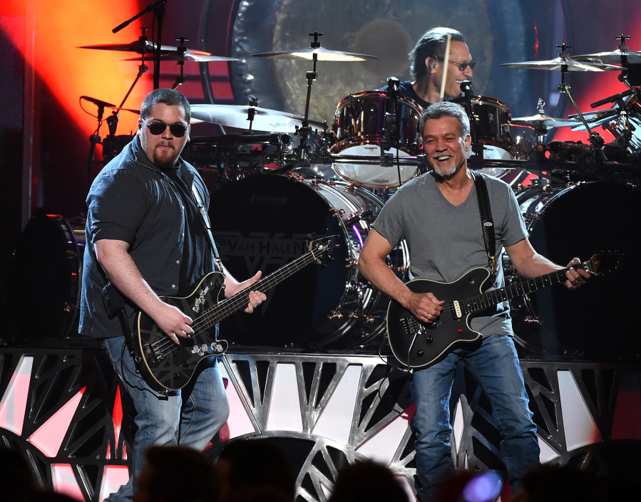 Musicians Wolfgang Van Halen, left, and Eddie Van Halen of Van Halen perform May 17, 2015 during the 2015 Billboard Music Awards at MGM Grand Garden Arena in Las Vegas.