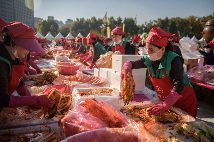 Volunteers take part in a kimchi-making festival in Seoul in 2018.