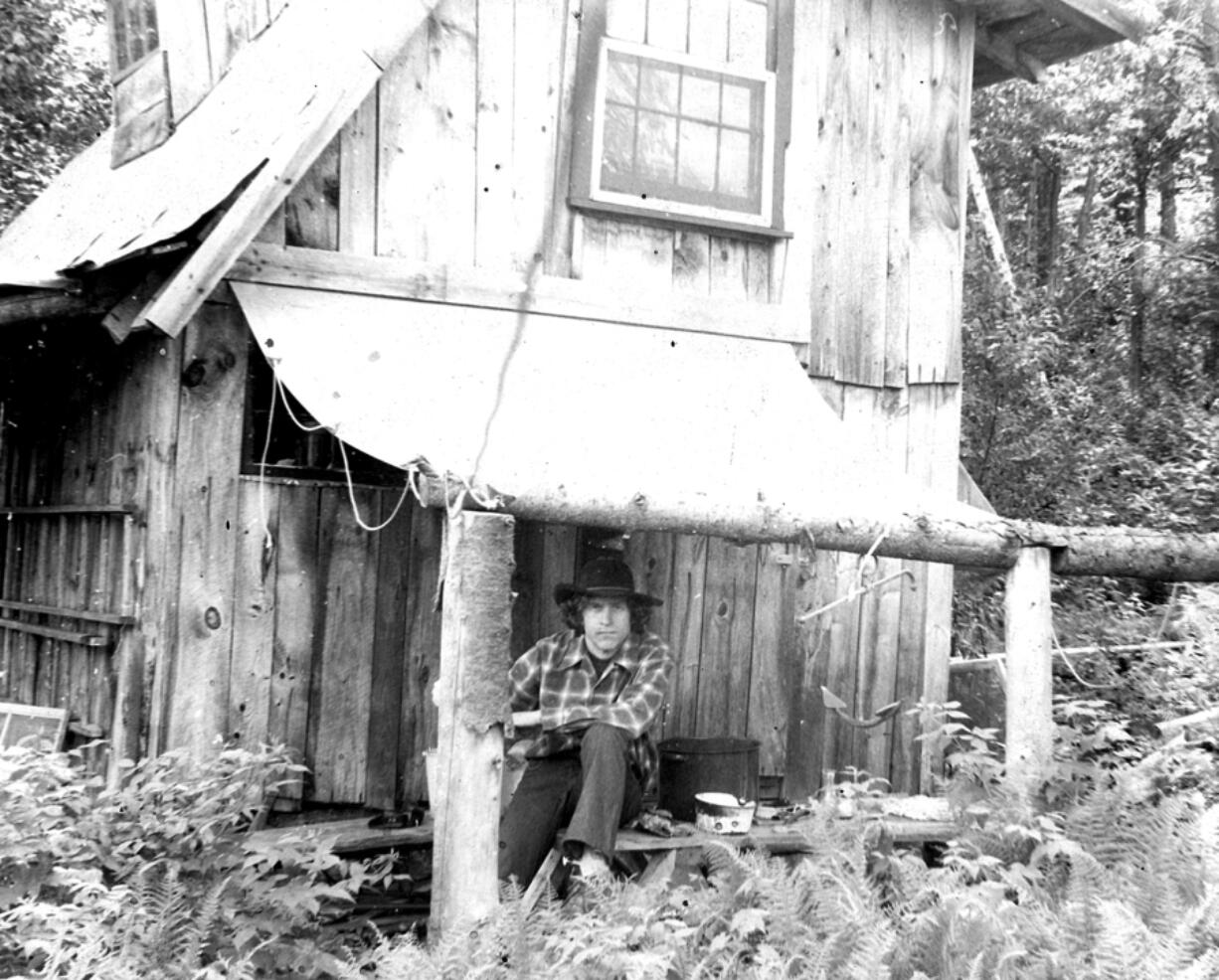Author Stephen Altschuler in 1977, age 32, and his home in the New Hampshire woods.