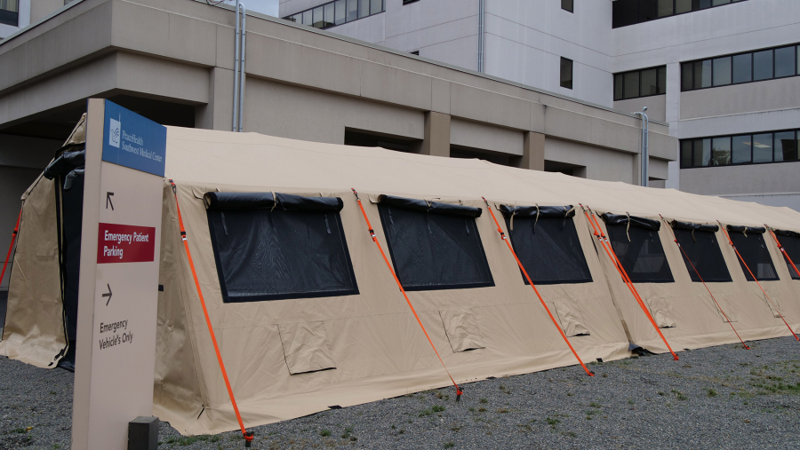 PeaceHealth Southwest Medical Center in Vancouver has erected a tent outside the entrance of its emergency department to serve as an overflow waiting area for patients seeking care.