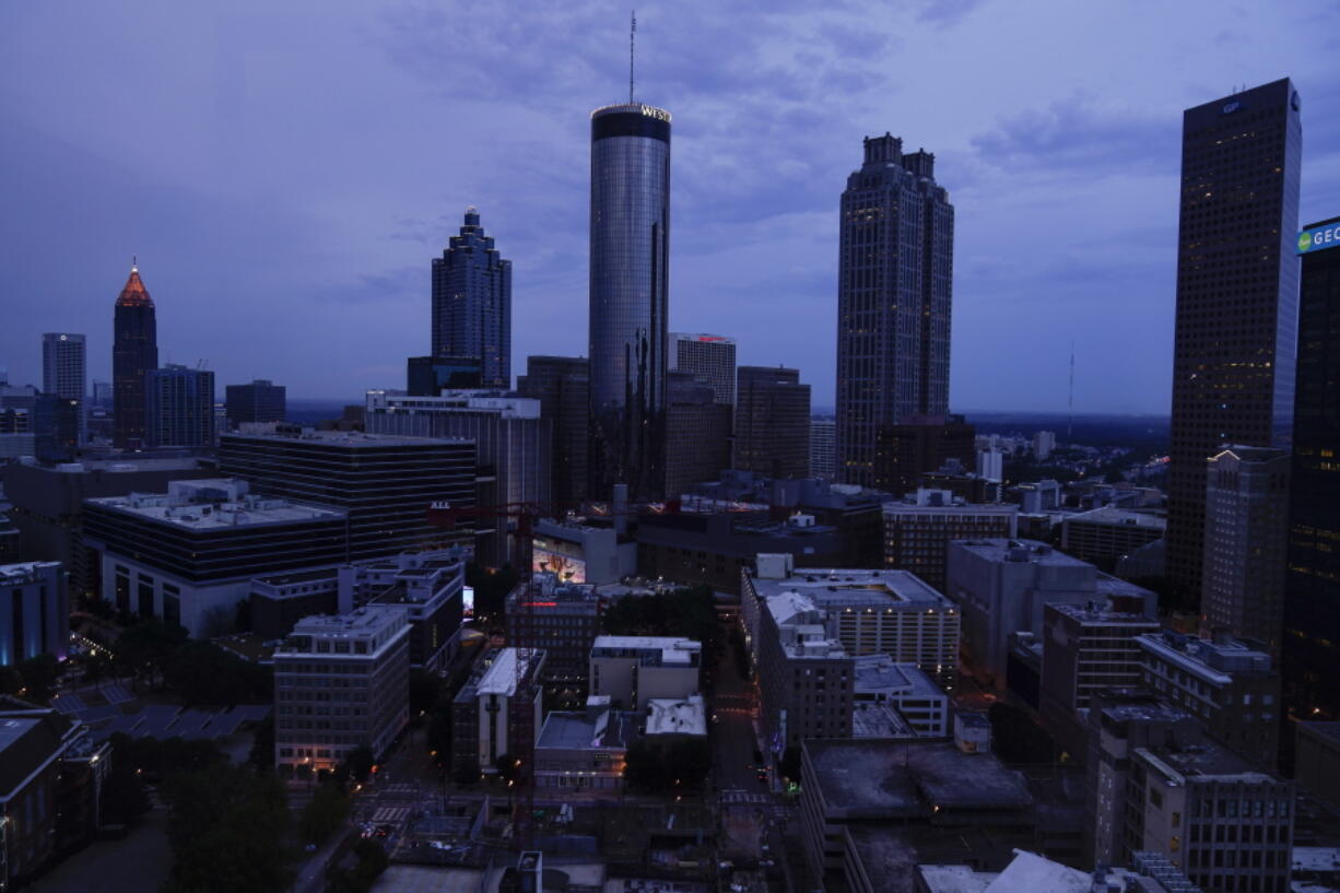Clouds roll into downtown Atlanta on Wednesday, Aug. 11, 2021, in Atlanta.  The Census Bureau has issued its most detailed portrait yet of how the U.S. has changed over the past decade. The agency on Thursday released a trove of demographic data that will used to redraw political maps across an increasingly diverse country.