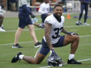 Seattle Seahawks safety Jamal Adams stretches before practice Tuesday, Aug. 17, 2021, in Renton. The Seahawks signed Adams to a four-year contract extension Tuesday that is expected to make the former All-Pro the highest-paid safety in the NFL. (AP Photo/Ted S.