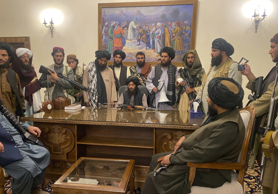 Taliban fighters take control of Afghan presidential palace after the Afghan President Ashraf Ghani fled the country, in Kabul, Afghanistan, Sunday, Aug. 15, 2021.