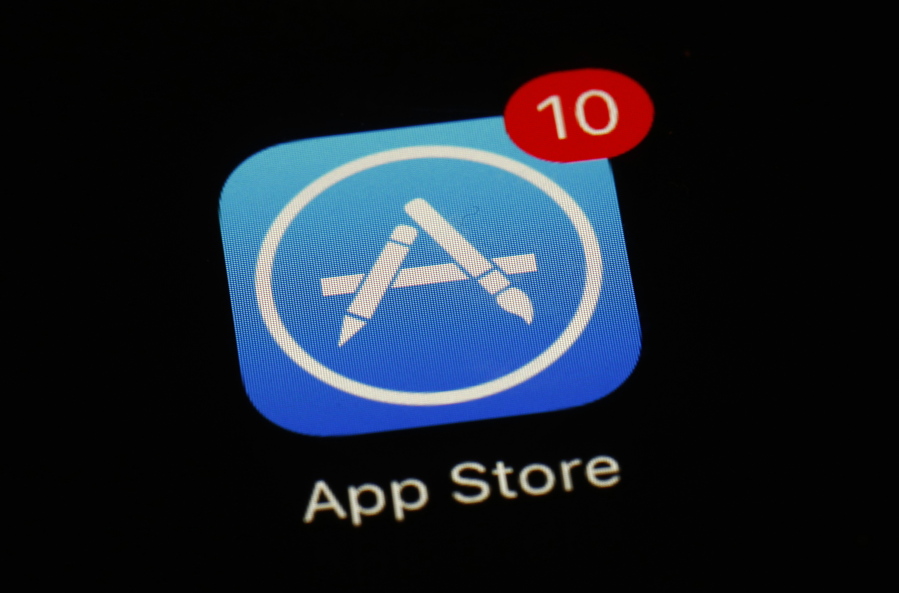 FILE - This March 19, 2018, file photo shows Apple's App Store app in Baltimore. Apple has agreed to let developers of iPhone apps email their users about cheaper ways to pay for digital subscriptions and media by circumventing a commission system that generates billions of dollars annually for the iPhone maker. The concession announced late Thursday, Aug. 26, 2021 is part of a preliminary settlement of a nearly 2-year-old lawsuit filed on behalf of iPhone app developers in the U.S.