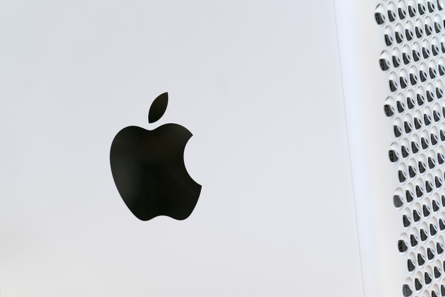 This May 21, 2021 photo shows the Apple logo displayed on a Mac Pro desktop computer  in New York.  Apple is planning to scan U.S.