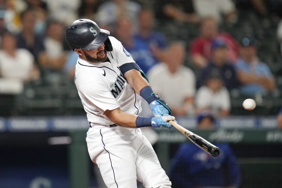 Seattle Mariners' Luis Torrens doubles in a pair of runs against the Toronto Blue Jays during the eighth inning of a baseball game Saturday, Aug. 14, 2021, in Seattle.