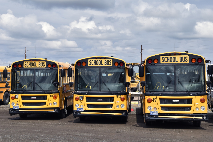 School buses parked in Helena, Mont., ahead of the beginning of the school year, Friday, Aug. 20, 2021. School districts across the country are coping with a shortage of bus drivers, a dilemma that comes even as they struggle to start a new school year during a new surge of the coronavirus pandemic.