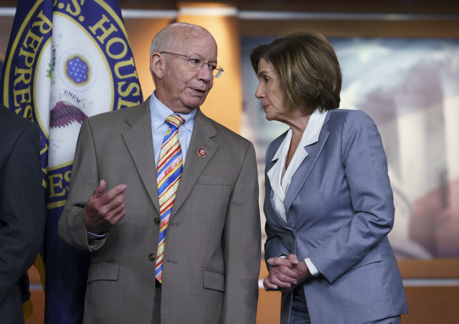 House Transportation and Infrastructure Committee Chair Peter DeFazio, D-Ore., left, talks to Speaker of the House Nancy Pelosi, D-Calif., during a news conference to discuss the "INVEST in America Act," a five-year surface transportation bill, which directs federal investments in roads, bridges, transit, and rail, at the Capitol in Washington, Wednesday, June 30, 2021. (AP Photo/J.