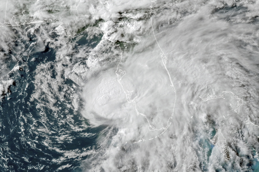 Tropical Storm Elsa in the Gulf of Mexico is seen July 6 off the coast of Florida. On Wednesday, the National Oceanic and Atmospheric Administration updated its outlook for the 2021 Atlantic season, slightly increasing the number of named storms and hurricanes expected in what is predicted to be a busy, but not record-breaking year.