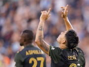 Portland Timbers forward Felipe Mora (9) celebrates after scoring a goal during the first half of an MLS soccer match against Sporting Kansas City Wednesday, Aug. 18, 2021, in Kansas City, Kan.