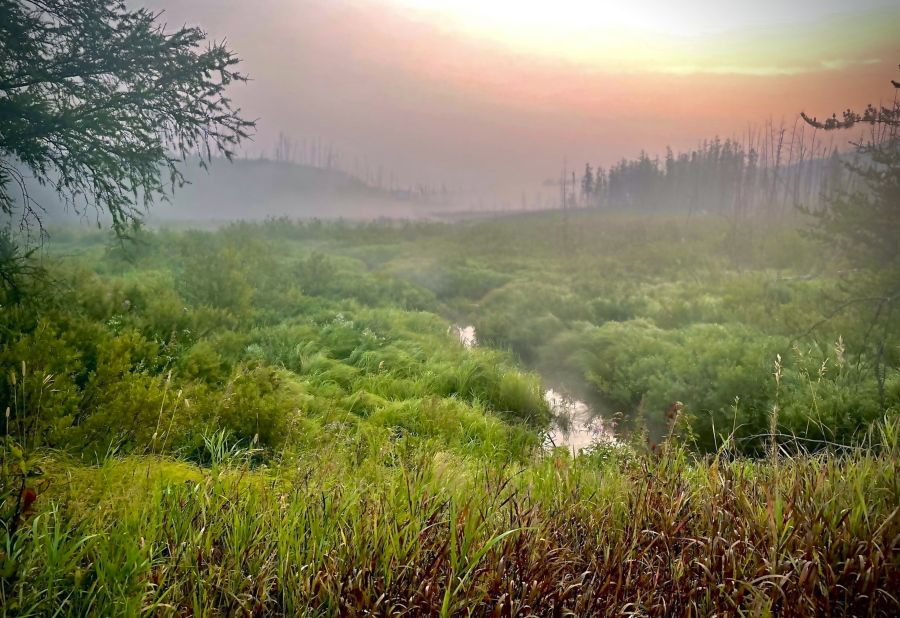 This image provided by the USDA Forest Service, shows a smoky, foggy sunrise along the Gunflint Trail on Tuesday, Aug. 24, 2021, in Superior National Forest in northern Minnesota. Residents well to the north along the upper Gunflint Trail, a dead-end highway that's a popular jumping off spot for Boundary Waters trips, were told Monday night to stand by in case they also needed to evacuate because of wildfires.