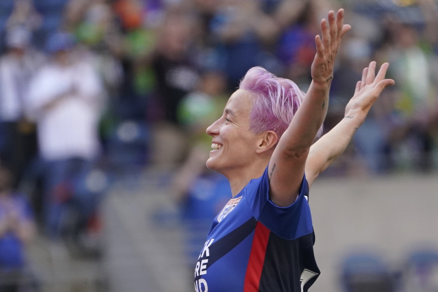 OL Reign forward Megan Rapinoe (15) celebrates after she scored a goal against the Portland Thorns during the first half of an NWSL soccer match, Sunday, Aug. 29, 2021, in Seattle. (AP Photo/Ted S.