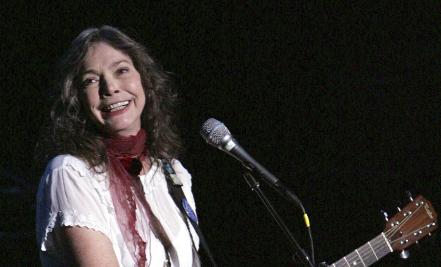 FILE - Nanci Griffith performs during the ACLU Freedom Concert Oct. 4, 2004, in New York. Griffith, the Grammy-winning folk singer-songwriter from Texas whose literary songs like "Love at the Five and Dime" celebrated the South, has died. She was 68. A statement from her management company on Friday, Aug. 13, 2021, confirmed her death, but no cause of death was provided.
