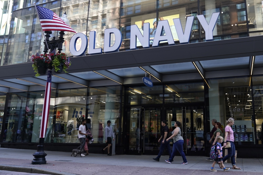 Pedestrians pass the Old Navy store in the Downtown Crossing shopping area, Wednesday, July 14, 2021, in Boston.  Gap's low-price division Old Navy is overhauling its approach to how it designs and markets to plus-size women, a growing demographic that many analysts say has been underserved. Starting Friday, Aug. 20, Old Navy  will be offering every one of its women's styles in all sizes with no price difference.