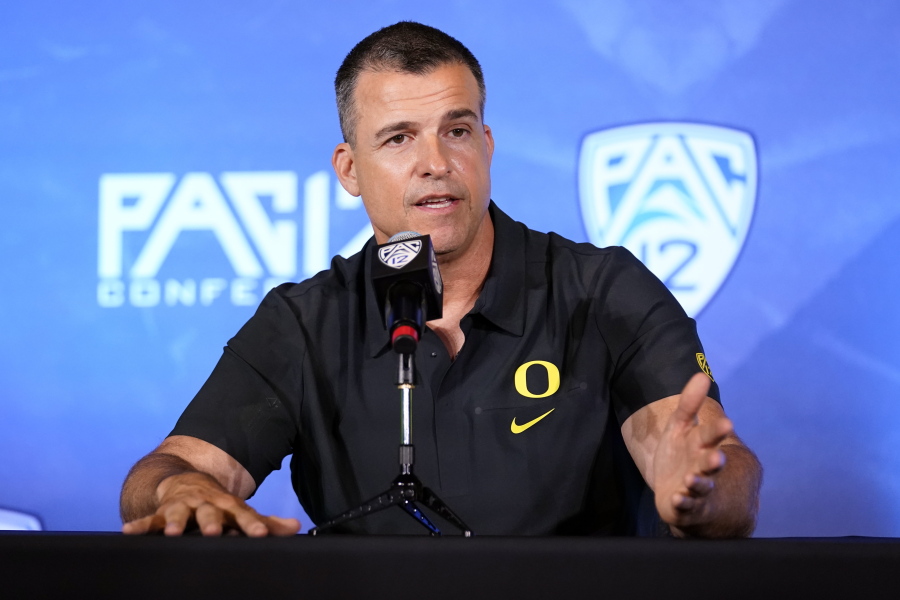 Oregon head coach Mario Cristobal answers questions during the Pac-12 Conference NCAA college football Media Day Tuesday, July 27, 2021, in Los Angeles.