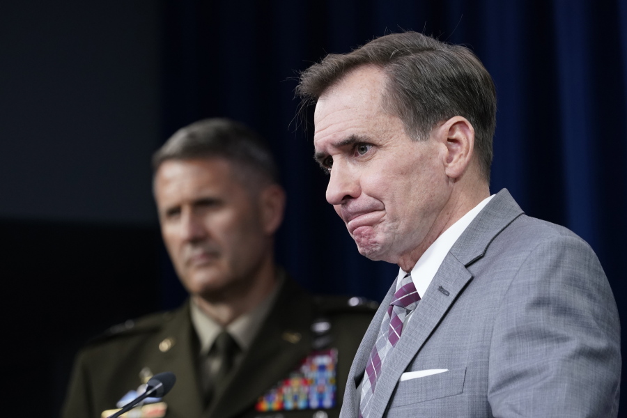 Pentagon spokesman John Kirby, right, and Army Maj. Gen. William "Hank" Taylor, left, listen to questions during a briefing at the Pentagon in Washington, Saturday, Aug. 28, 2021.