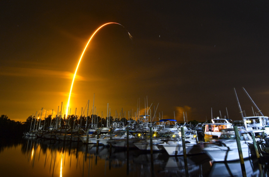 This long exposure photo shows the launch of a SpaceX Falcon 9 rocket on a resupply mission for NASA to the International Space Station from Pad 39A at Kennedy Space Center, seen from Merritt Island, Fla., Sunday, Aug. 29, 2021. The SpaceX shipment of ants, avocados and a human-sized robotic arm rocketed toward the International Space Station on Sunday.